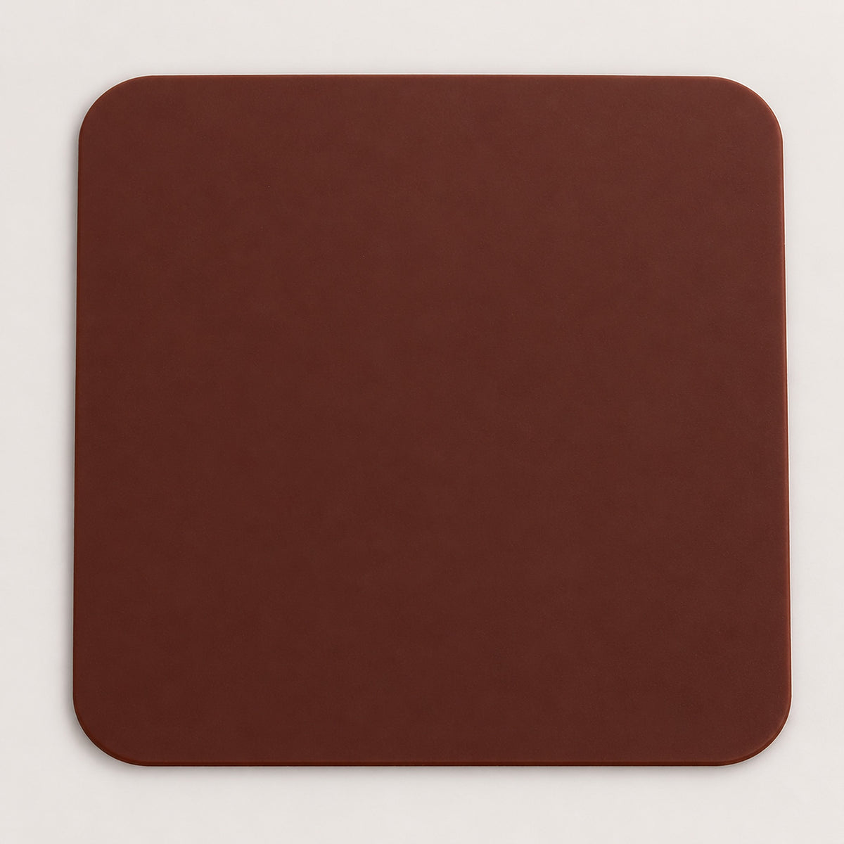 One brown square silicone coaster, 10 x 10 cm.