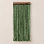 Forest green straight fringe panel hanging from a dark wood batten on cream