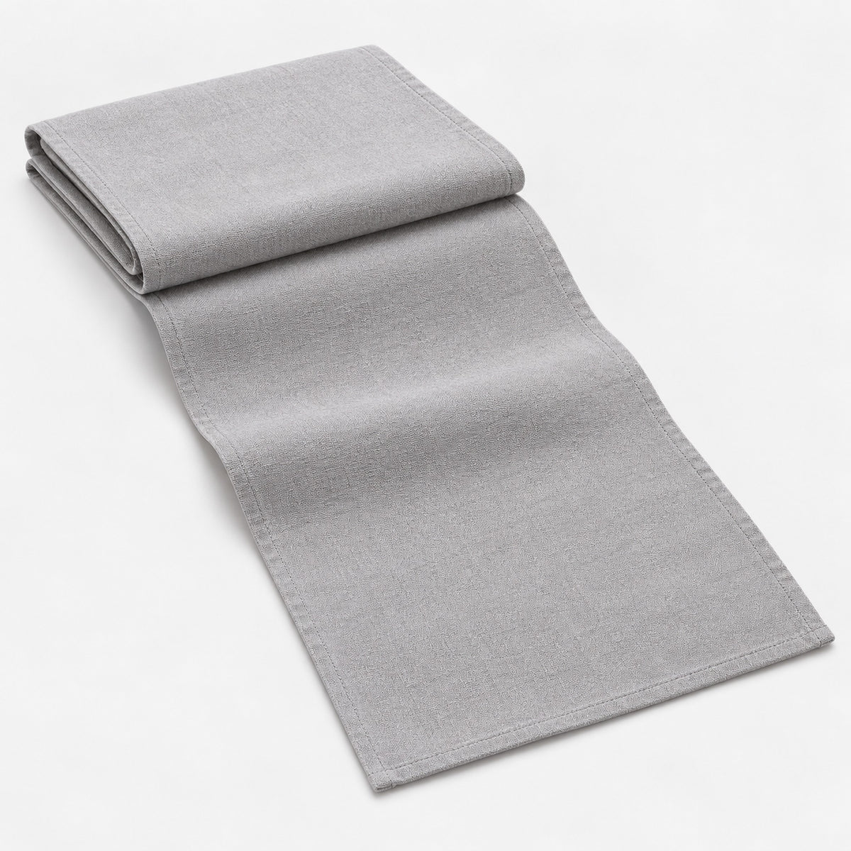 Light Gray cotton table runner with sewn edges, folded studio view; choose length separately.
