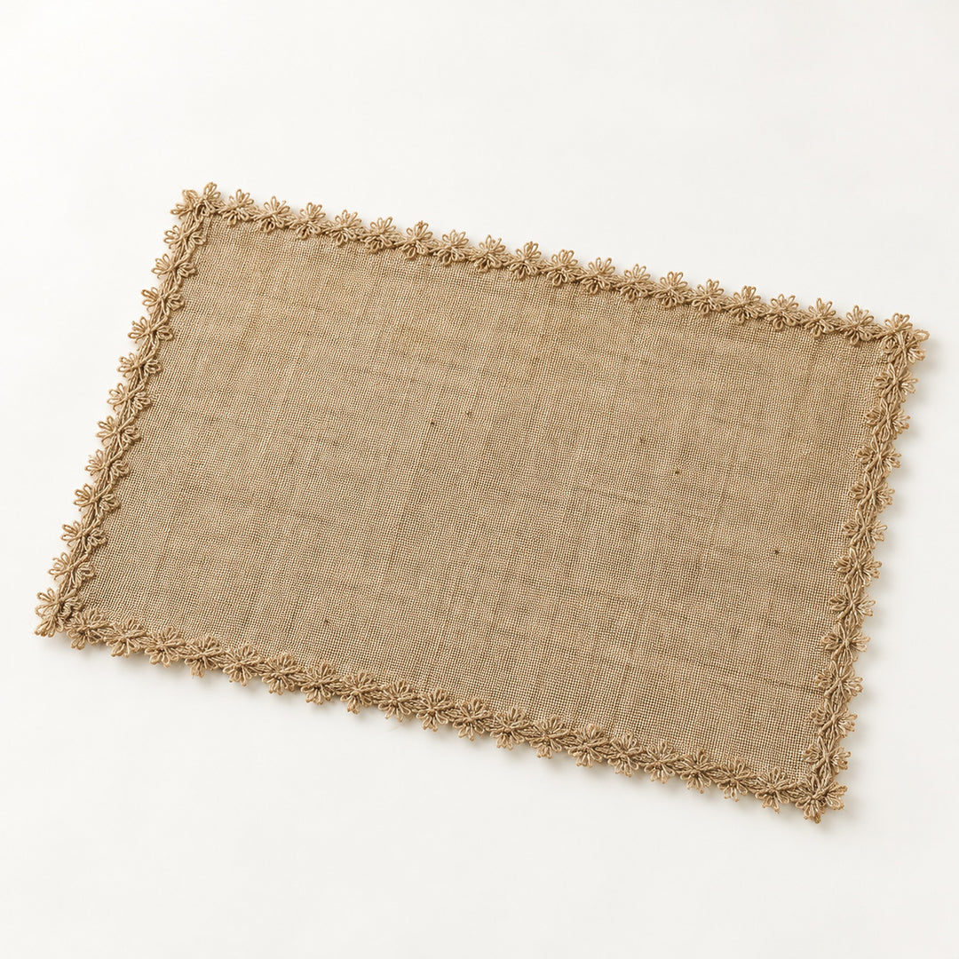 One tan placemat with tan looped trim, 30 x 45 cm.