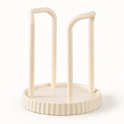 An off-white plastic cup holder or organizer with two upright curved legs on a round fluted base, shown on a clean white background.