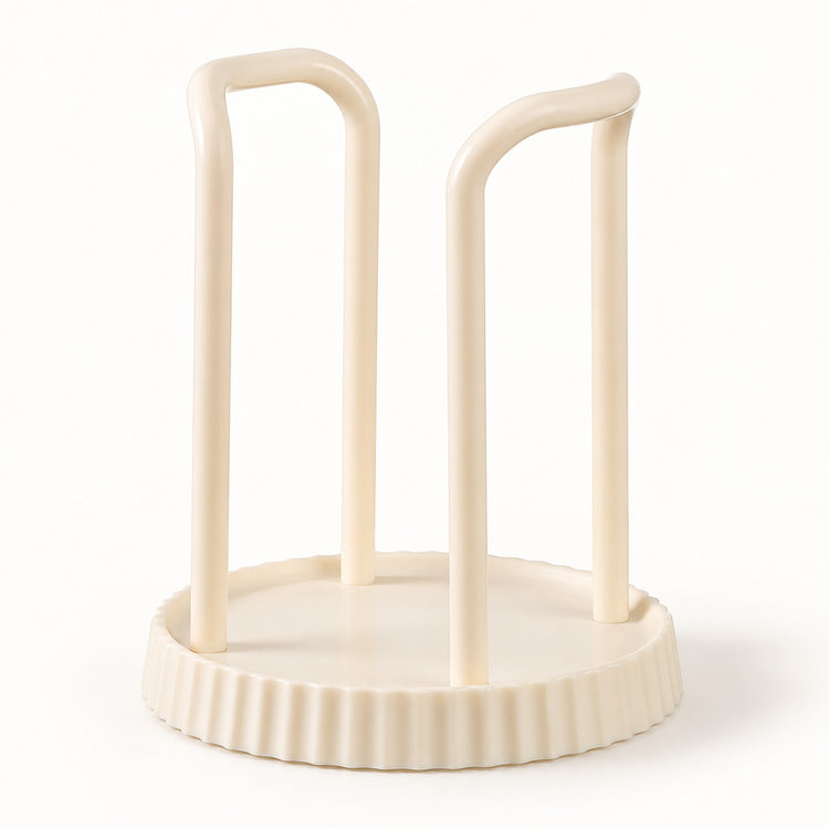 An off-white plastic cup holder or organizer with two upright curved legs on a round fluted base, shown on a clean white background.