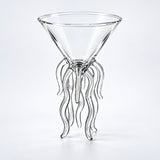 Empty 100 ml cocktail glass with wavy support legs.