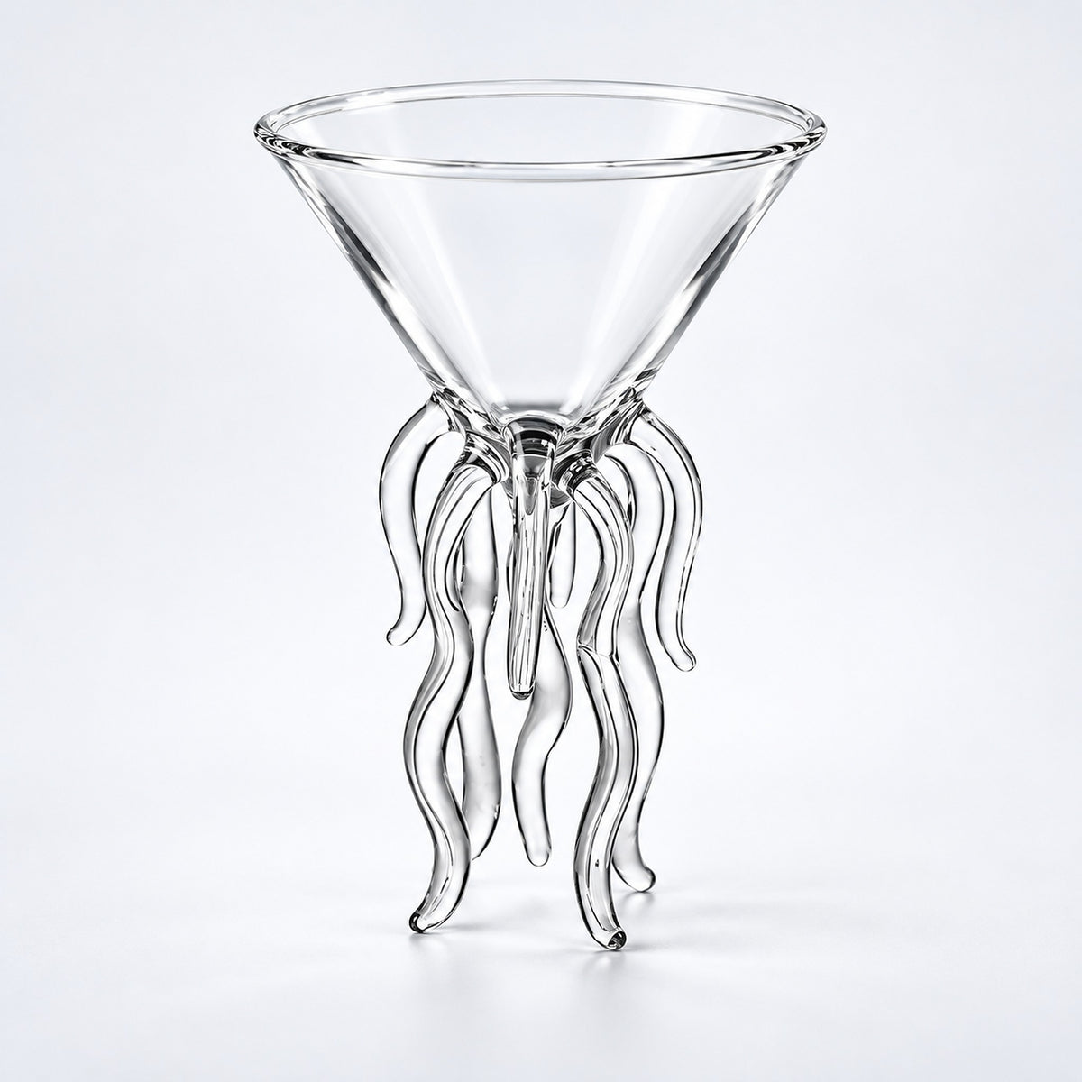 Empty 100 ml cocktail glass with wavy support legs.