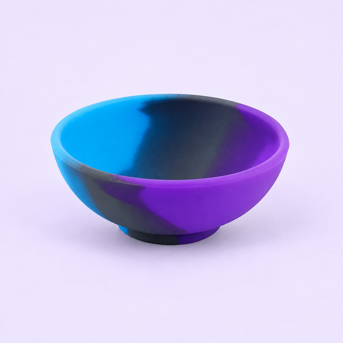 Blue, purple and black mini silicone bowl, single empty piece in studio.