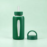 Green 800 ml glass bottle with silicone sleeve, wide straw and spare loop lid.