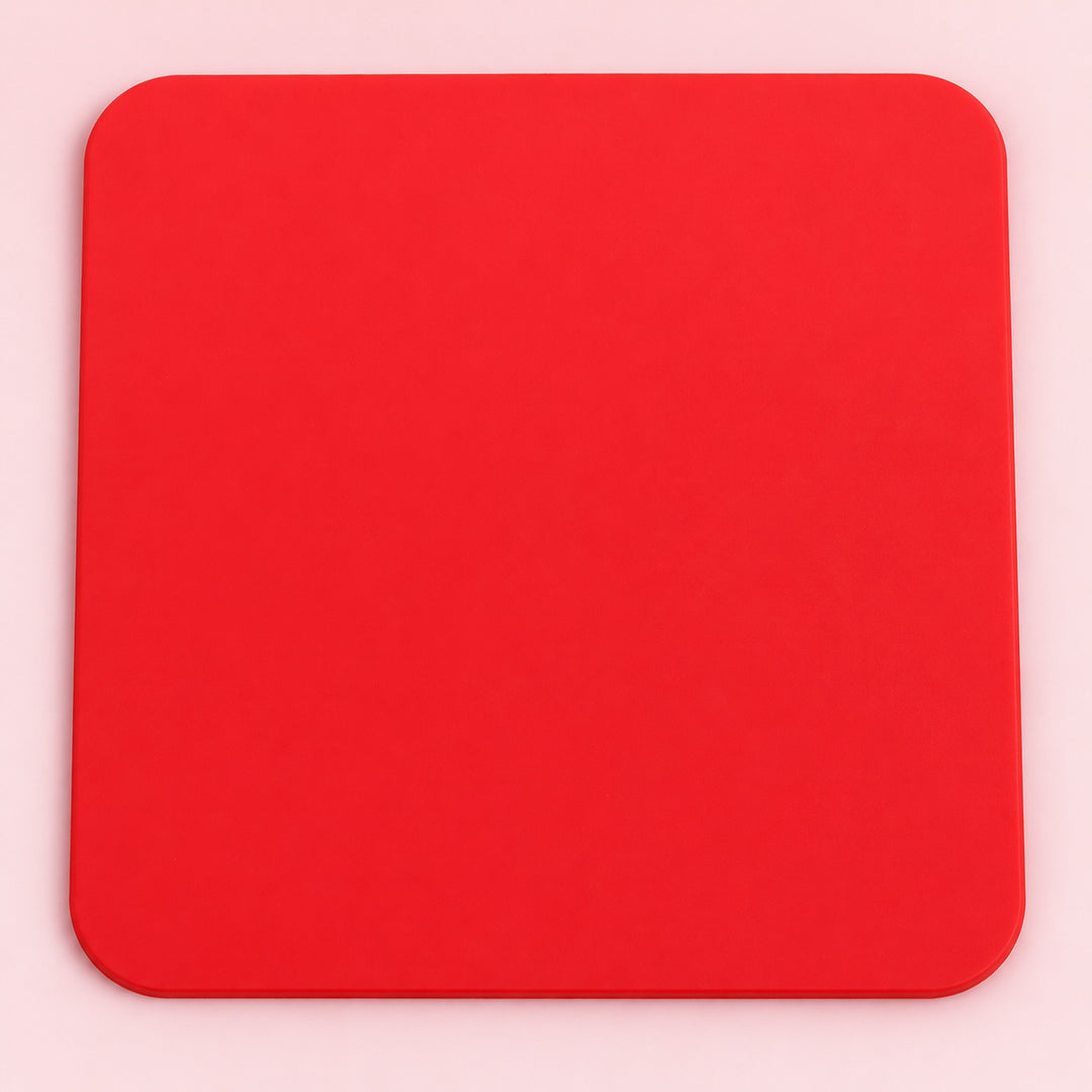One red square silicone coaster, 10 x 10 cm.