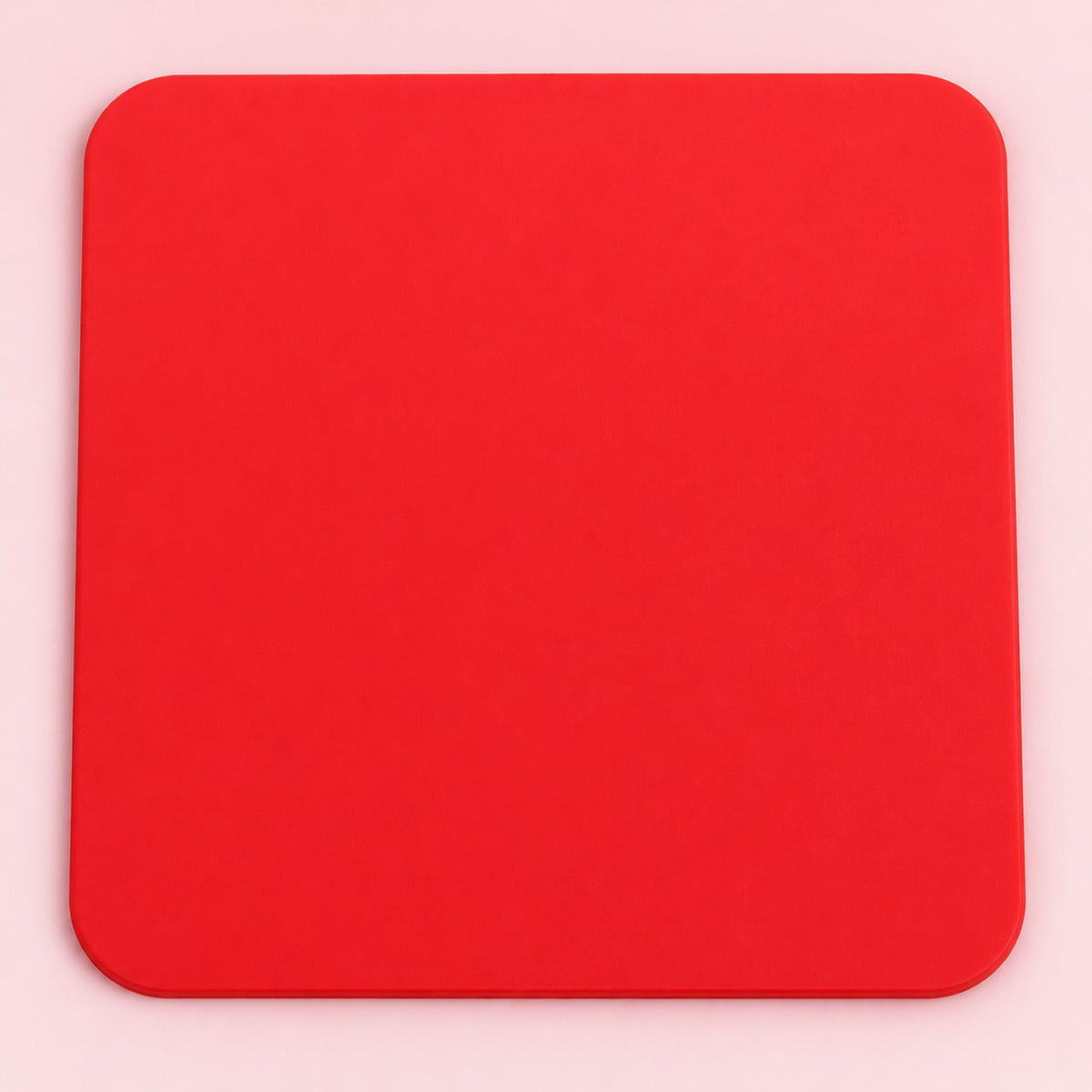 One red square silicone coaster, 10 x 10 cm.