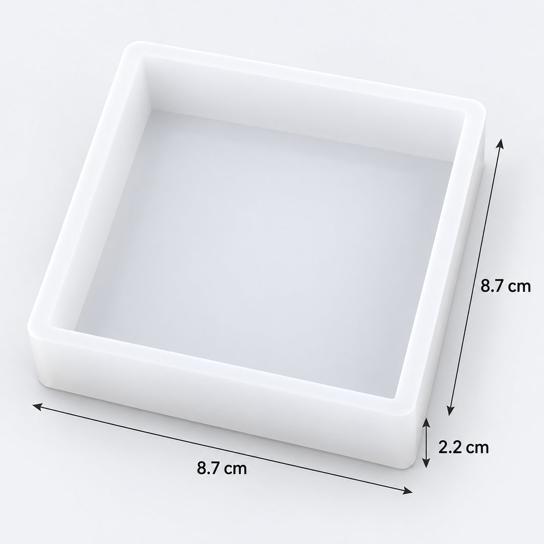 A square white tray or mold shown on a light gray background with dimension arrows and labels indicating 8.7 cm by 8.
