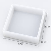 A square white tray or mold shown on a light gray background with dimension arrows and labels indicating 8.7 cm by 8.