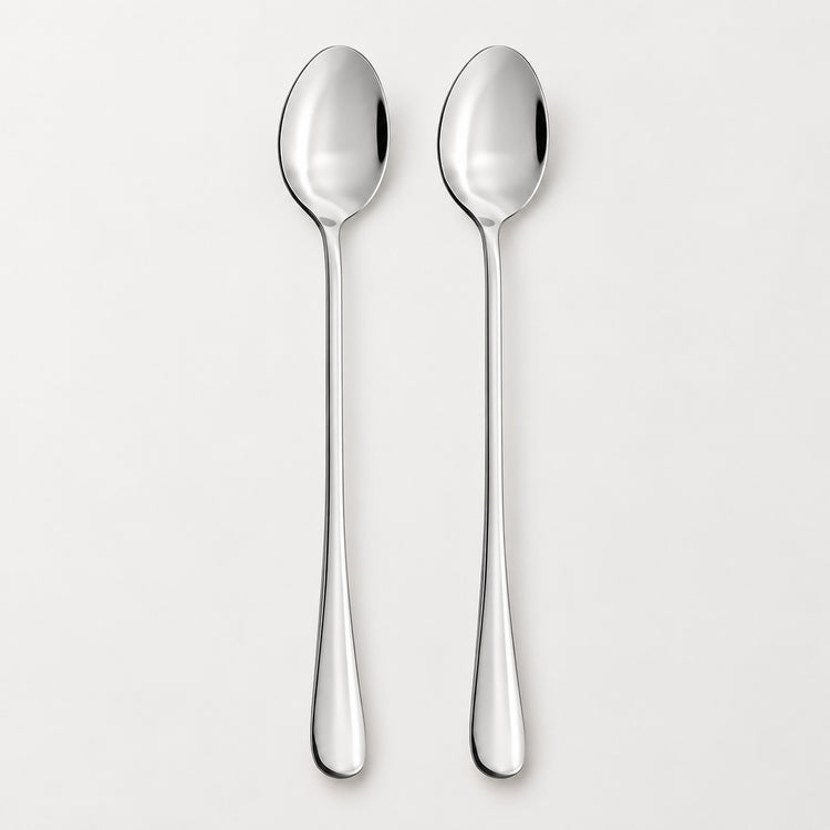 Two polished stainless steel spoons with long handles, shown vertically side-by-side on a clean, light gray background.
