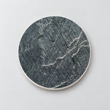 One charcoal fine vein marble printed ceramic coaster on a light studio background.
