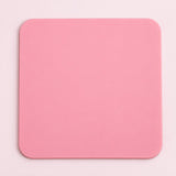 One pink square silicone coaster, 10 x 10 cm.
