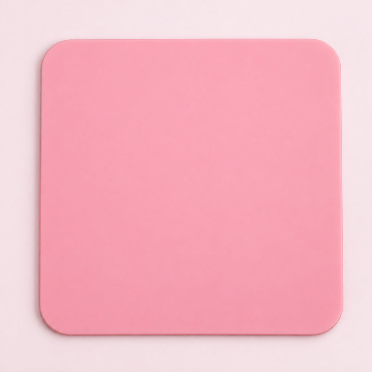One pink square silicone coaster, 10 x 10 cm.
