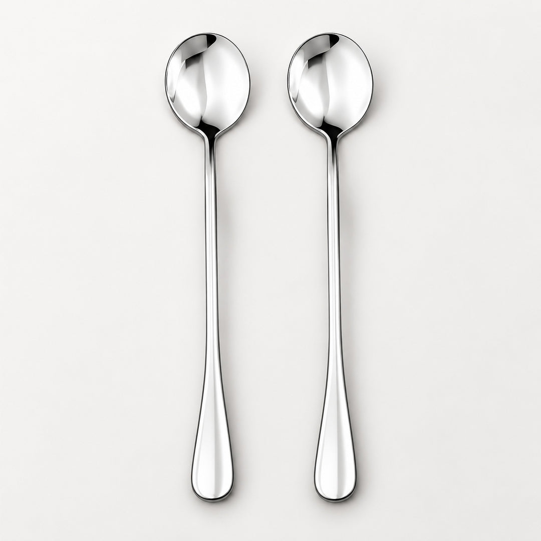 Two polished stainless steel spoons with long handles, shown side by side on a clean, light gray background.