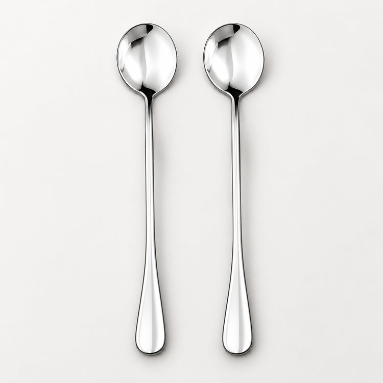 Two polished stainless steel spoons with long handles, shown side by side on a clean, light gray background.