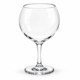 A clear glass coupe-style wine glass with a wide, rounded bowl, a slender stem, and a flat circular base, shown on a plain white background.