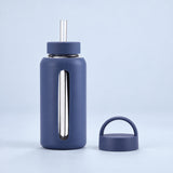 Indigo Blue 800 ml glass bottle with silicone sleeve, wide straw and spare loop lid.