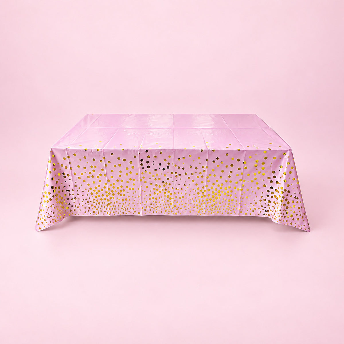 pink with gold dots disposable plastic table cover style.