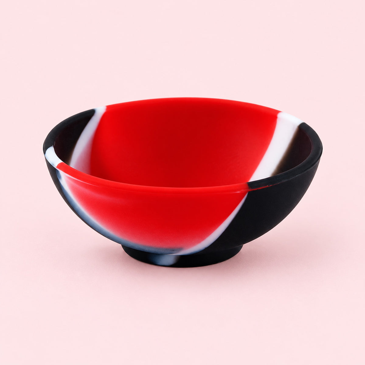 Red, black and white mini silicone bowl, single empty piece in studio.