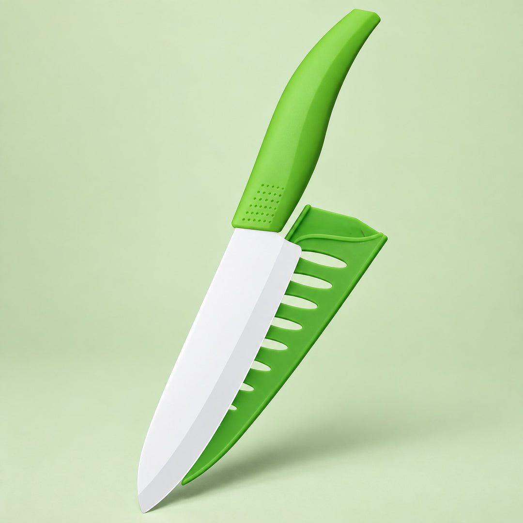 A small kitchen knife with a bright green handle and a matching green sheath, shown on a light green studio background.