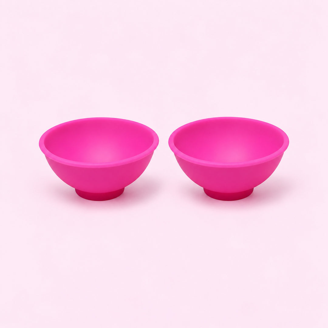 Two pink silicone mini bowls, open tops and pedestal bases.