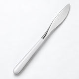 One white and silver dinner knife on a soft studio background.