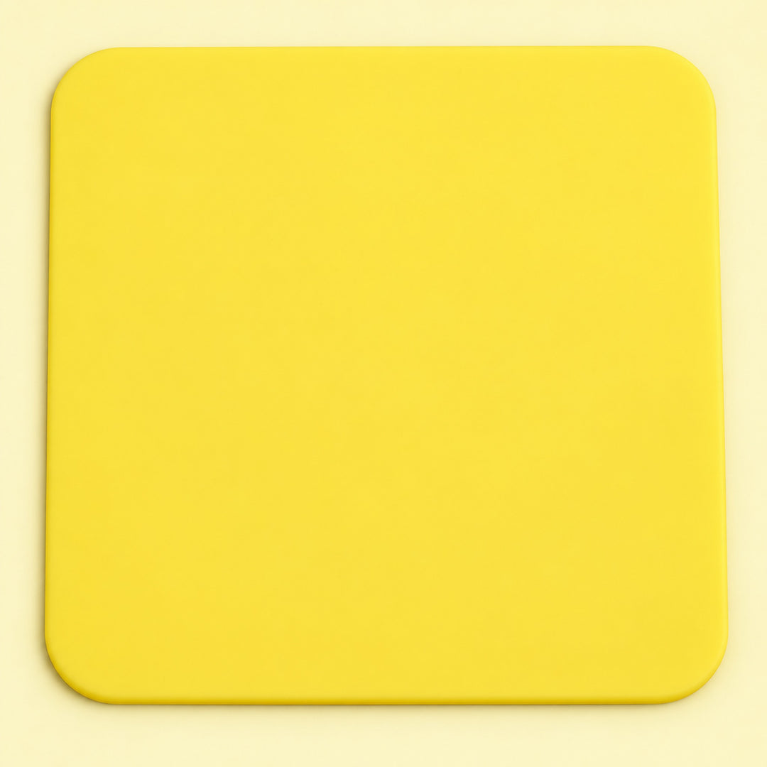 One yellow square silicone coaster, 10 x 10 cm.