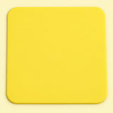 One yellow square silicone coaster, 10 x 10 cm.