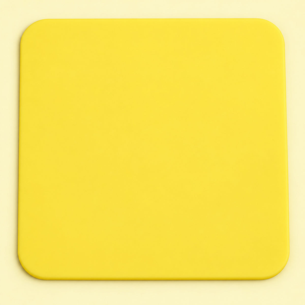 One yellow square silicone coaster, 10 x 10 cm.