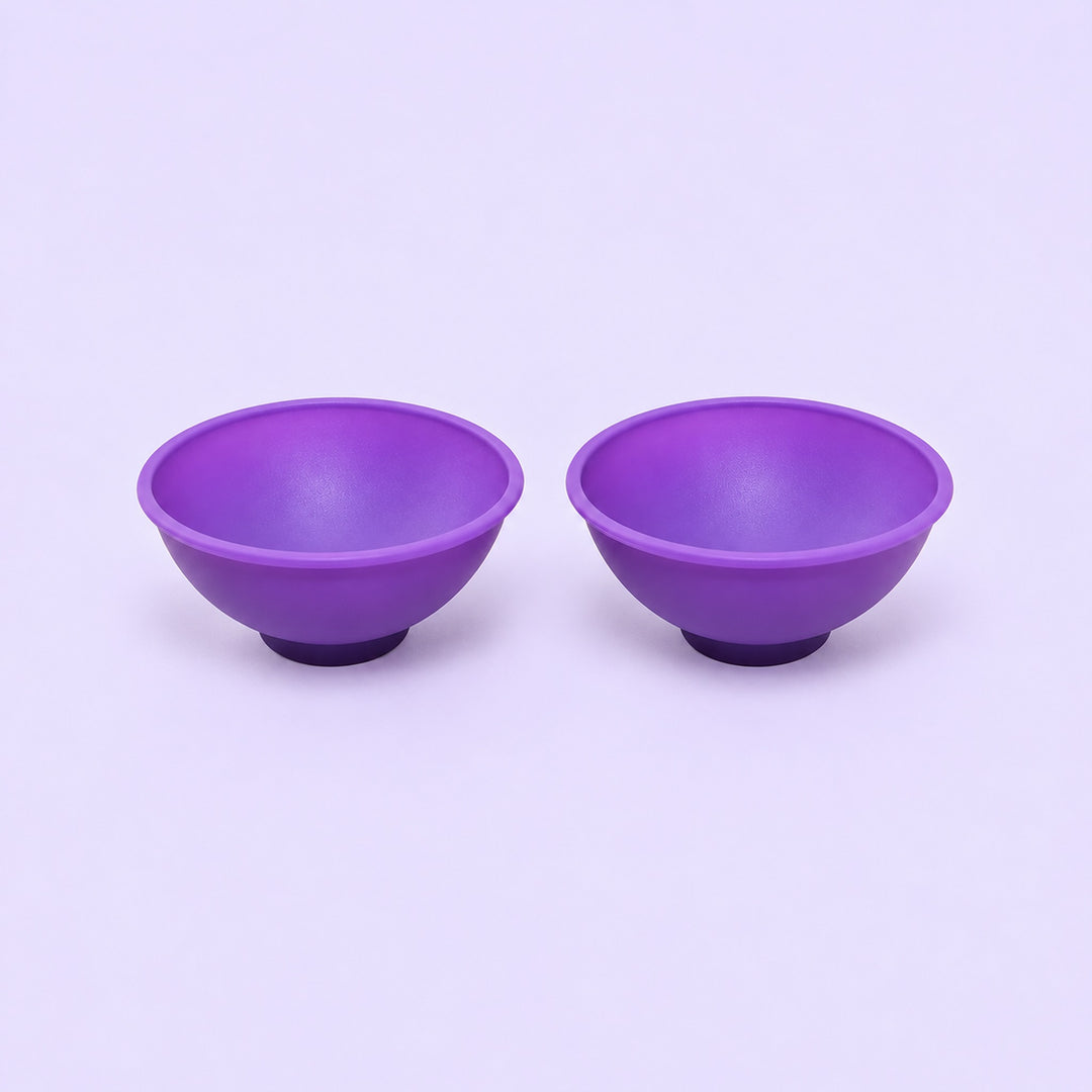Two purple silicone mini bowls, open tops and pedestal bases.