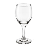 A clear glass wine glass with a wide bowl, a slender stem, and a flat circular base, photographed on a plain white background.