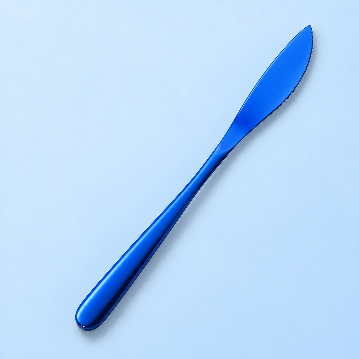 One blue dinner knife on a soft studio background.