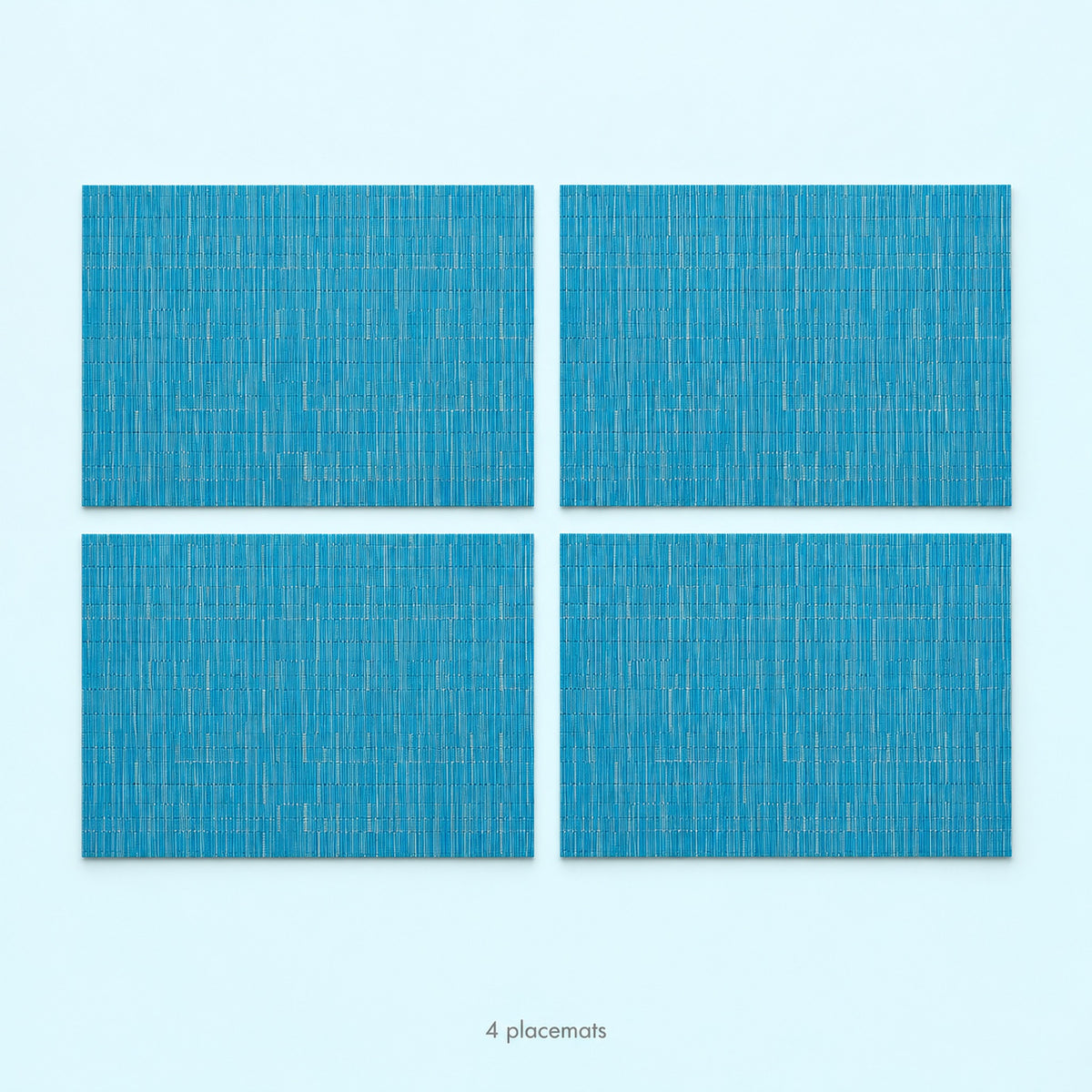 Blue woven vinyl placemats, 4-piece set, 30 by 45 cm each.
