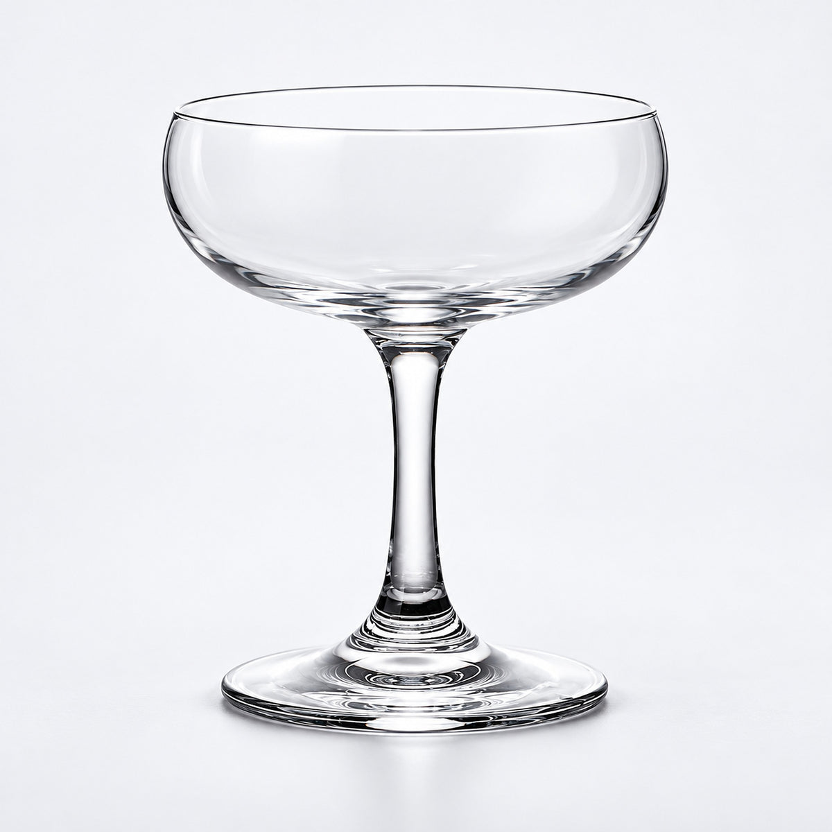 Empty 140 ml short-stem coupe glass.