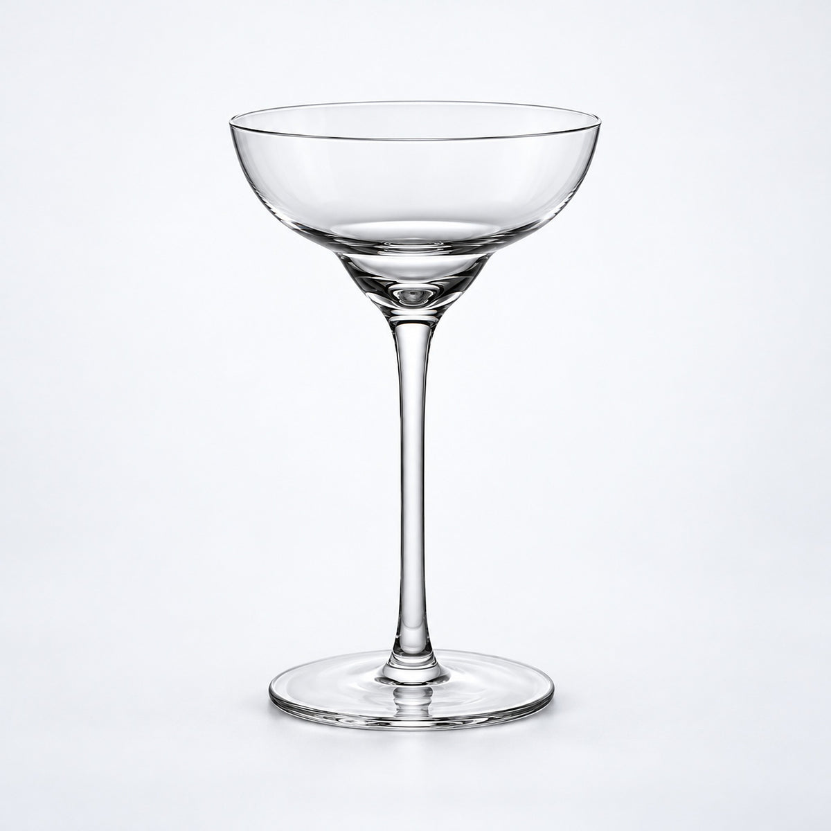 Empty 140 ml tall-stem rounded coupe glass.