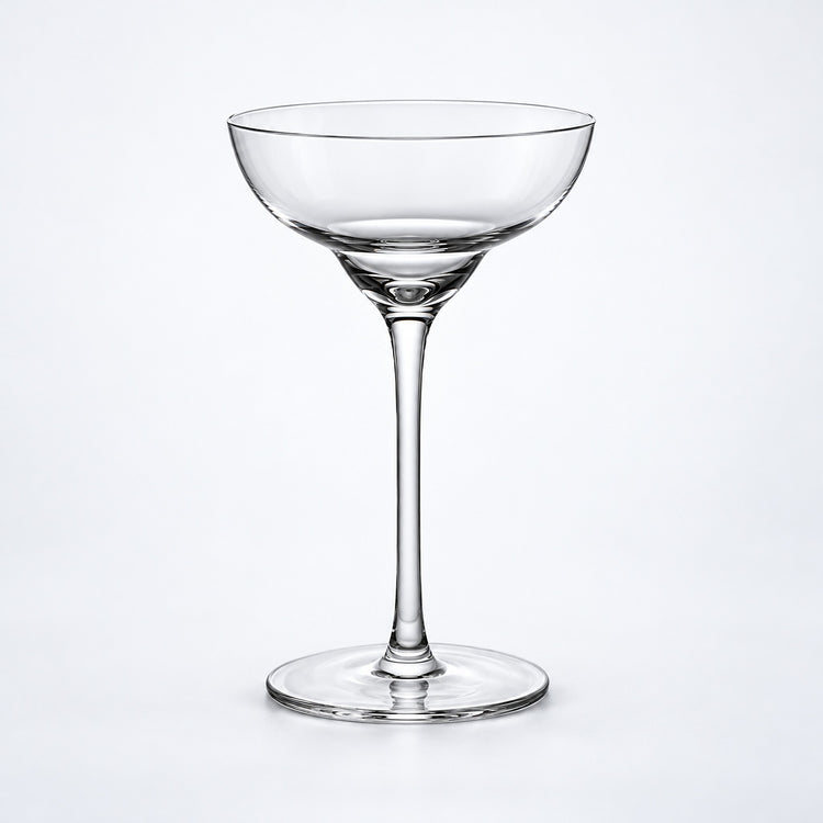 Empty 140 ml tall-stem rounded coupe glass.