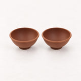Two coffee brown silicone mini bowls, open tops and pedestal bases.