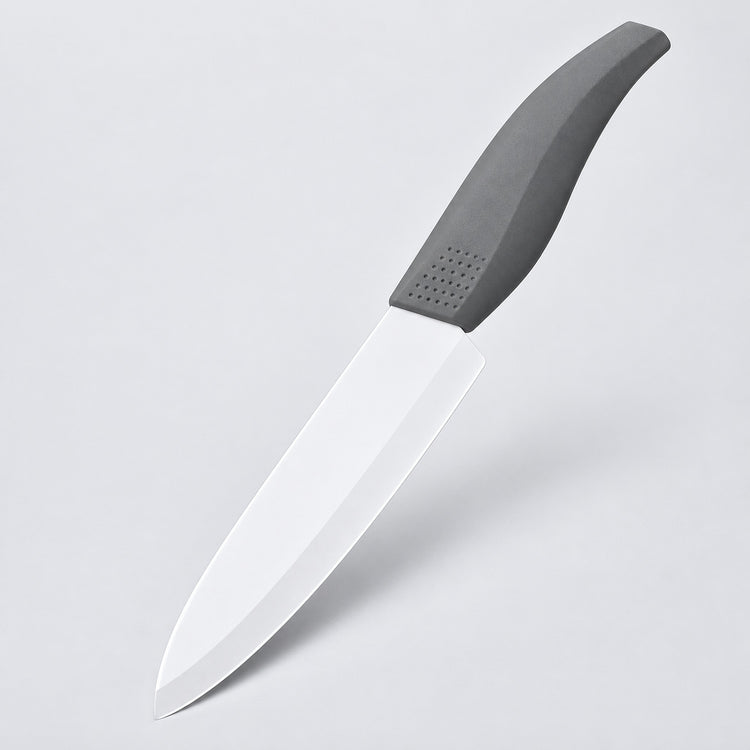 A kitchen knife with a matte gray handle and a satin-finished silver blade, shown diagonally against a light gray background.