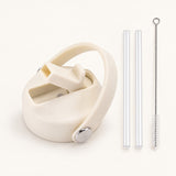 Cream replacement lid with two clear straws and a cleaning brush.