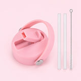 Pink replacement lid with two clear straws and a cleaning brush.