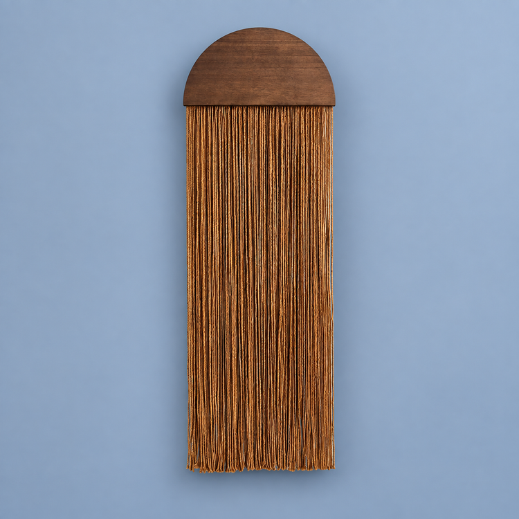 Rust straight fringe panel below a dark half round wood top on blue