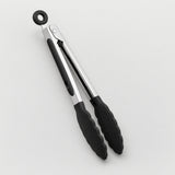 A pair of kitchen tongs with black silicone grips and a hanging loop at the top, shown on a clean light gray background.