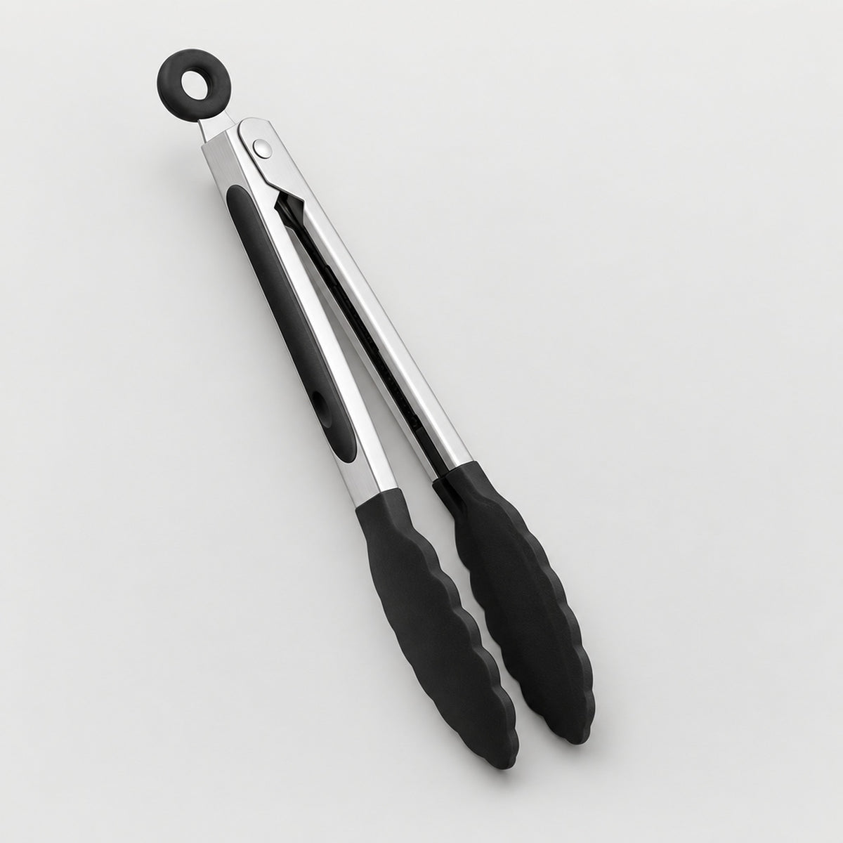 A pair of kitchen tongs with black silicone grips and a hanging loop at the top, shown on a clean light gray background.