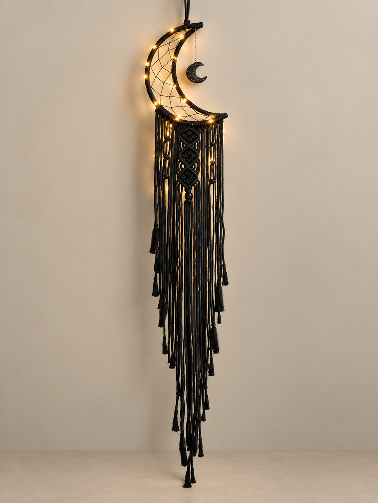Charcoal macrame moon dream catcher lit with warm white fairy lights