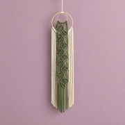 Sage green knotted leaf vine down cream cord curtains from a wooden ring on mauve