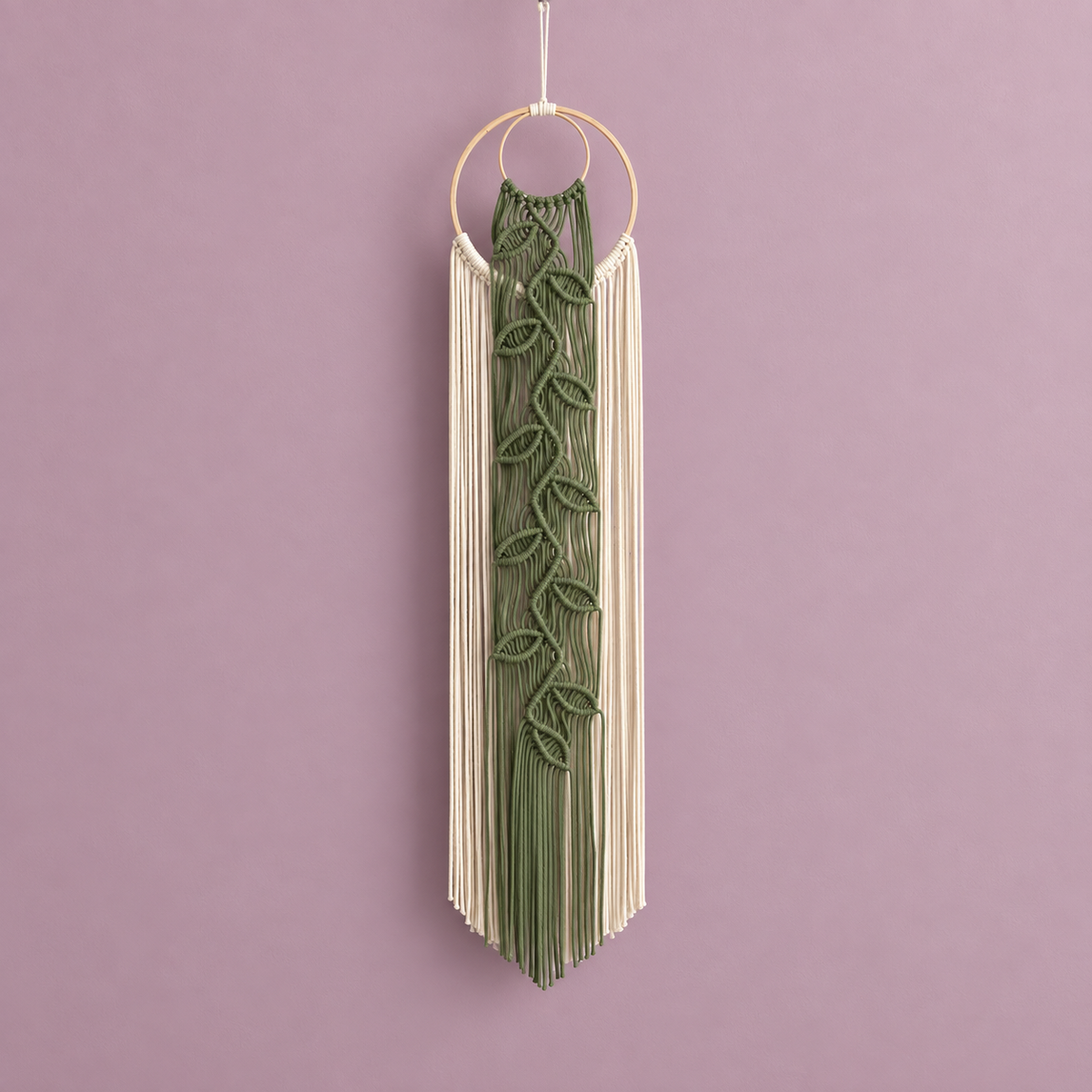 Sage green knotted leaf vine down cream cord curtains from a wooden ring on mauve