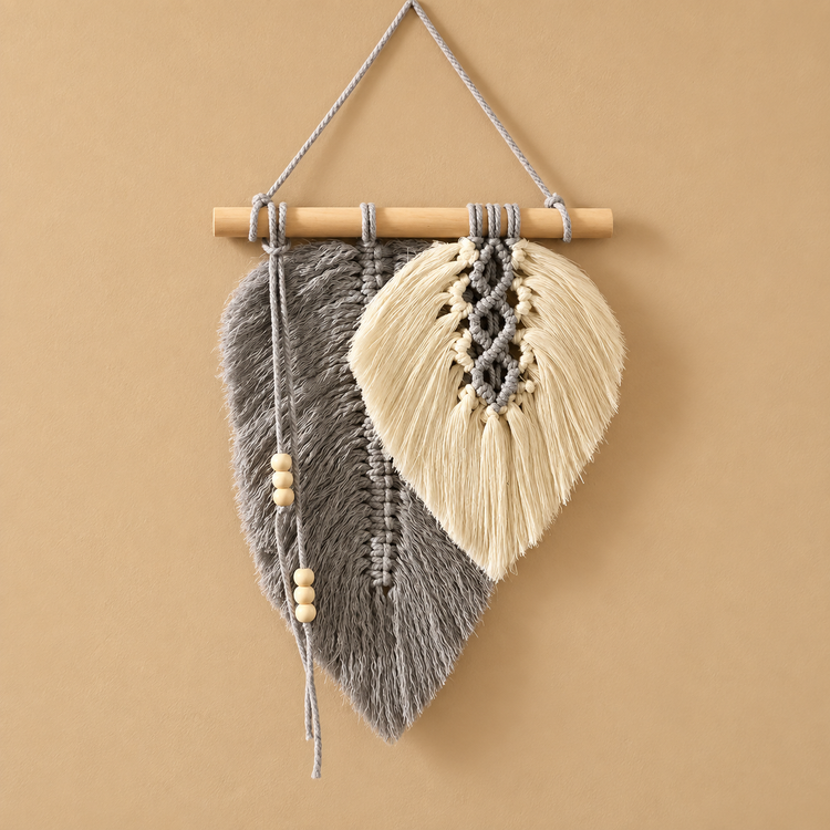 Charcoal and cream combed macrame leaf on a wooden dowel against mustard