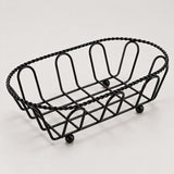 Oval black wire serving basket with twisted rim and small feet, 19 cm long.