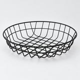 Round shallow black wire serving basket, 20 cm wide.